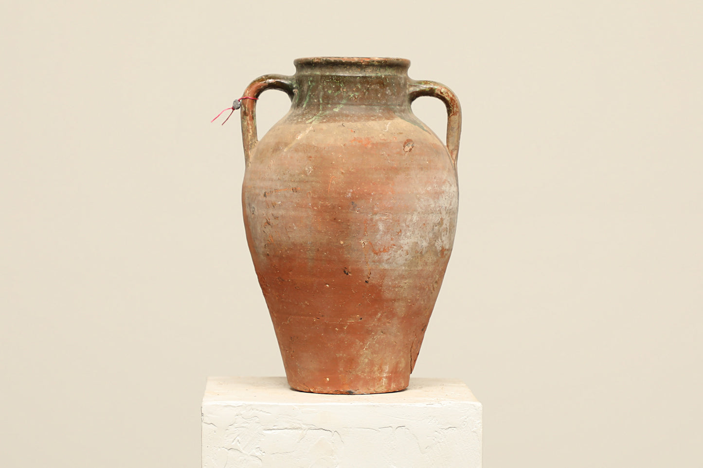 A one-of-a-kind rustic red Turkish vintage vase pot with two handles, crafted from terra cotta clay, this piece showcases timeless quality and antique craftsmanship, adding a unique touch of history to your space
