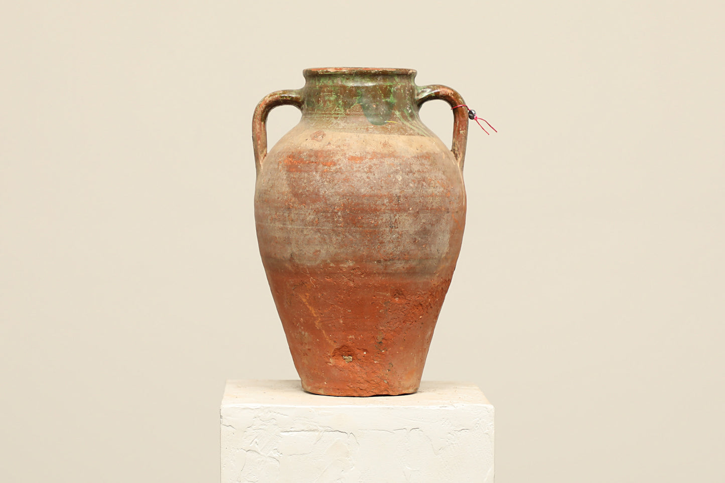 A one-of-a-kind rustic red Turkish vintage vase pot with two handles, crafted from terra cotta clay, this piece showcases timeless quality and antique craftsmanship, adding a unique touch of history to your space
