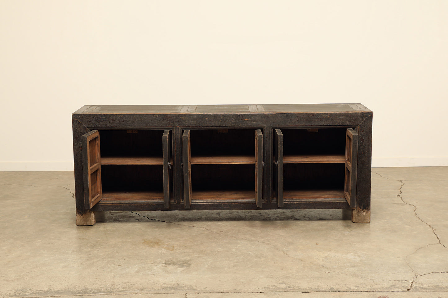 A one-of-a-kind, vintage rustic dark brown sideboard 3 cabinets handcrafted of elm natural wood in a farmhouse style, 82 inches long is narrow at 18 inches.