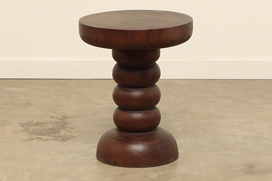 Palma 16-inch round top side table is crafted of sun-bleached acacia wood with a carved pillar base.