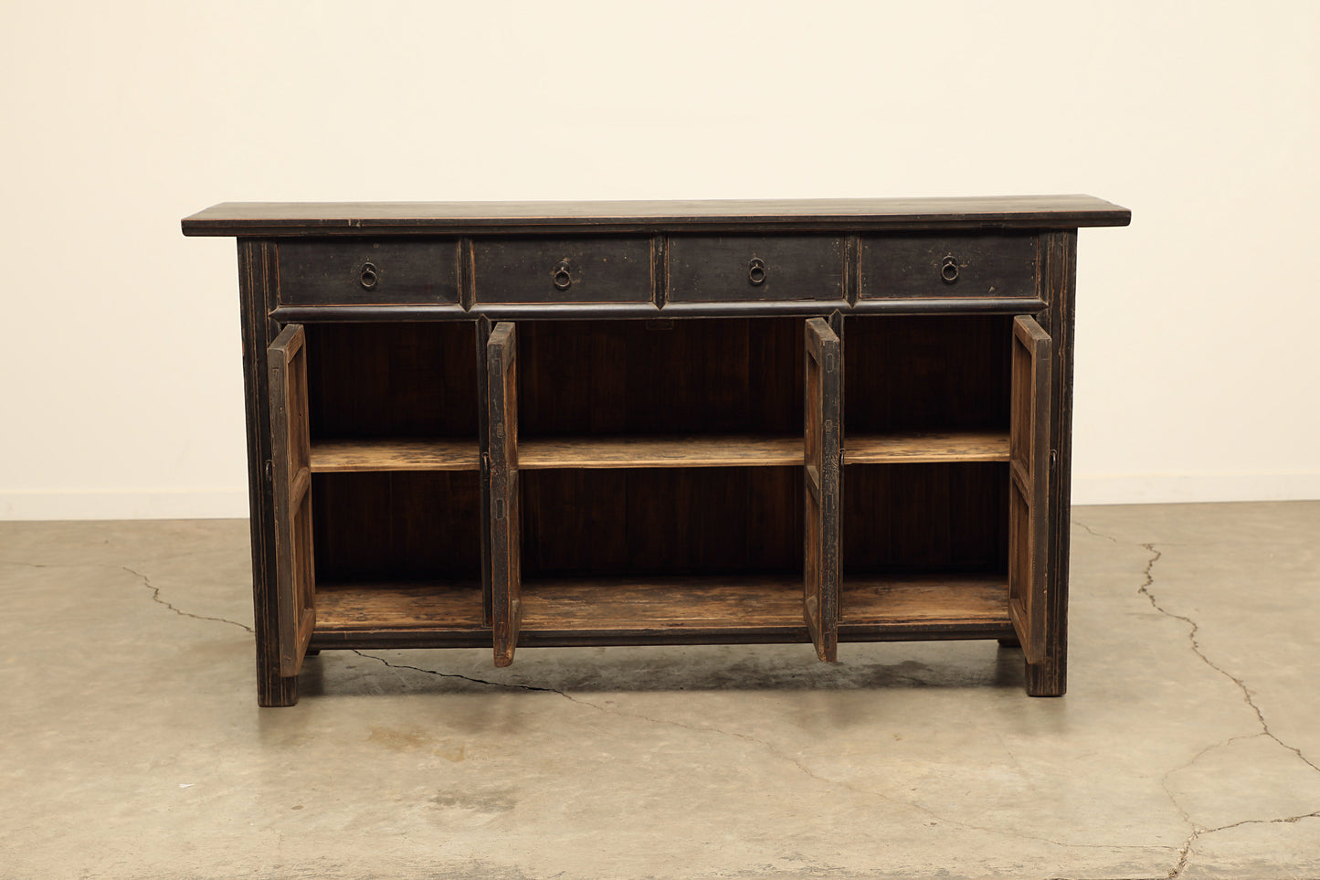 A timeless, one-of-a-kind, vintage dark brown sideboard cabinet handcrafted of elm natural solid wood in a rustic farmhouse-style buffet storage cabinet 81 inches long.