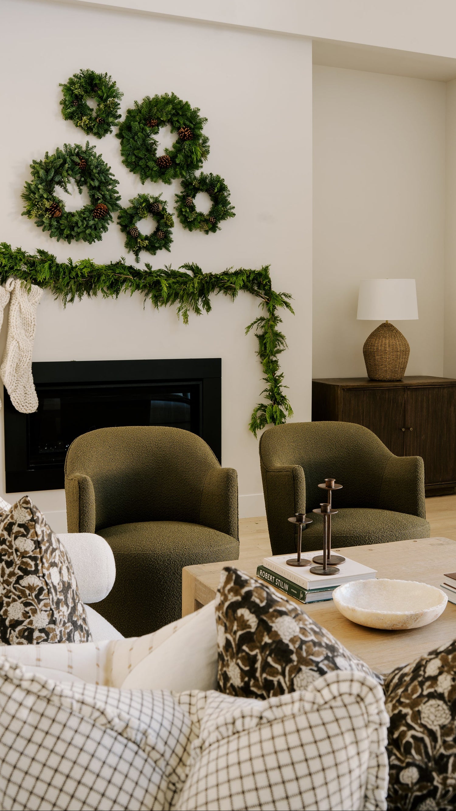 Modern home living room furniture and decor, custom sofa sectional, arm chairs, solid wood side boards, candle holders, stone bowl and decor by Habitat and Home and Garden