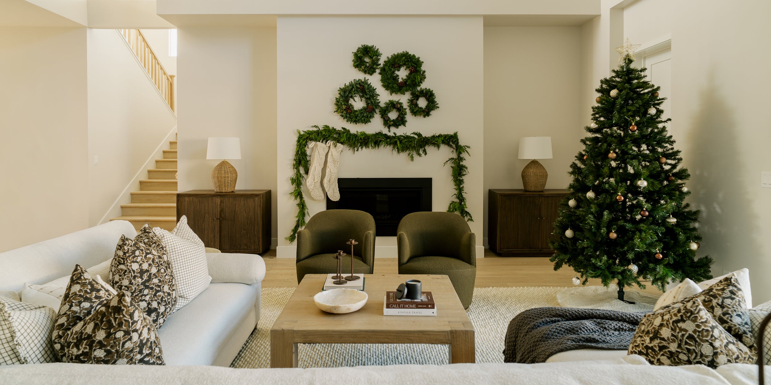 Modern home living room furniture and decor, custom sofa sectional, arm chairs, solid wood side boards, candle holders, stone bowl and decor by Habitat and Home and Garden