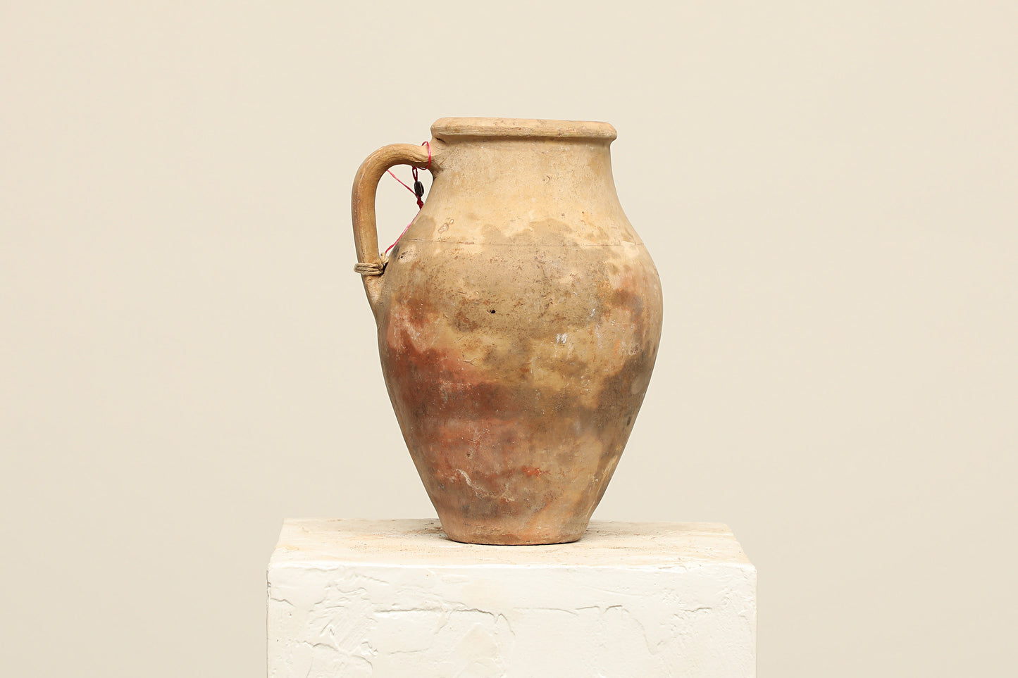 A one-of-a-kind brown Turkish vintage vase pot with a handle, crafted from terra cotta clay, this piece showcases timeless quality and antique craftsmanship, adding a unique touch of history to your space