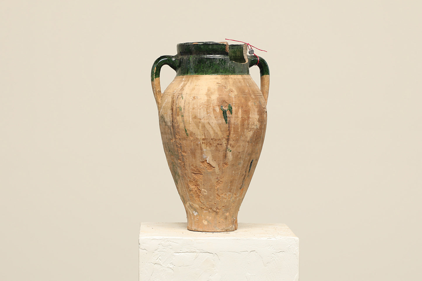 A one-of-a-kind brown Turkish vintage vase pot with two handles, crafted from terra cotta clay, this piece showcases timeless quality and antique craftsmanship, adding a unique touch of history to your space