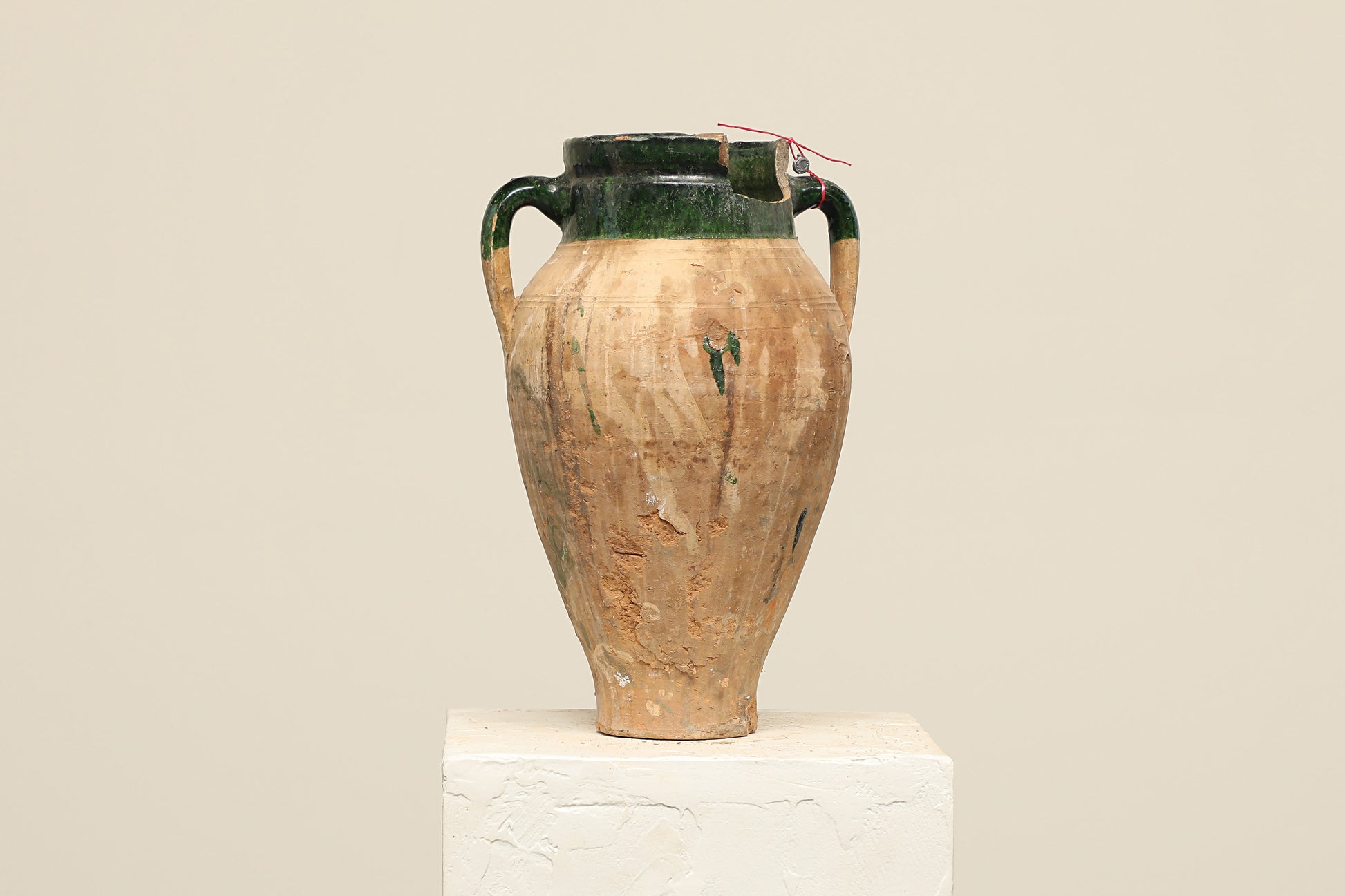 A one-of-a-kind brown Turkish vintage vase pot with two handles, crafted from terra cotta clay, this piece showcases timeless quality and antique craftsmanship, adding a unique touch of history to your space