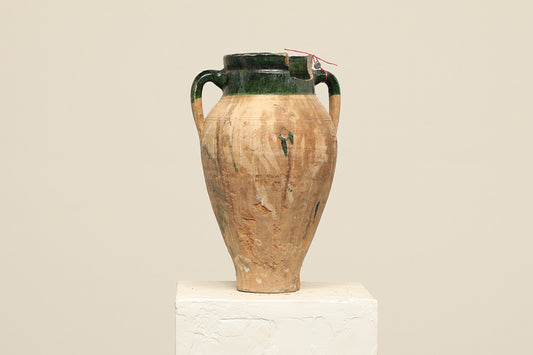 A one-of-a-kind brown Turkish vintage vase pot with two handles, crafted from terra cotta clay, this piece showcases timeless quality and antique craftsmanship, adding a unique touch of history to your space