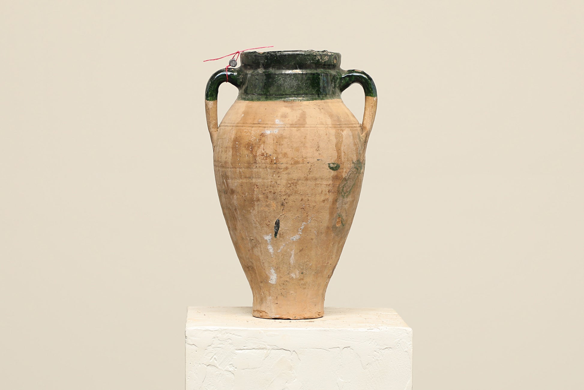A one-of-a-kind brown Turkish vintage vase pot with two handles, crafted from terra cotta clay, this piece showcases timeless quality and antique craftsmanship, adding a unique touch of history to your space