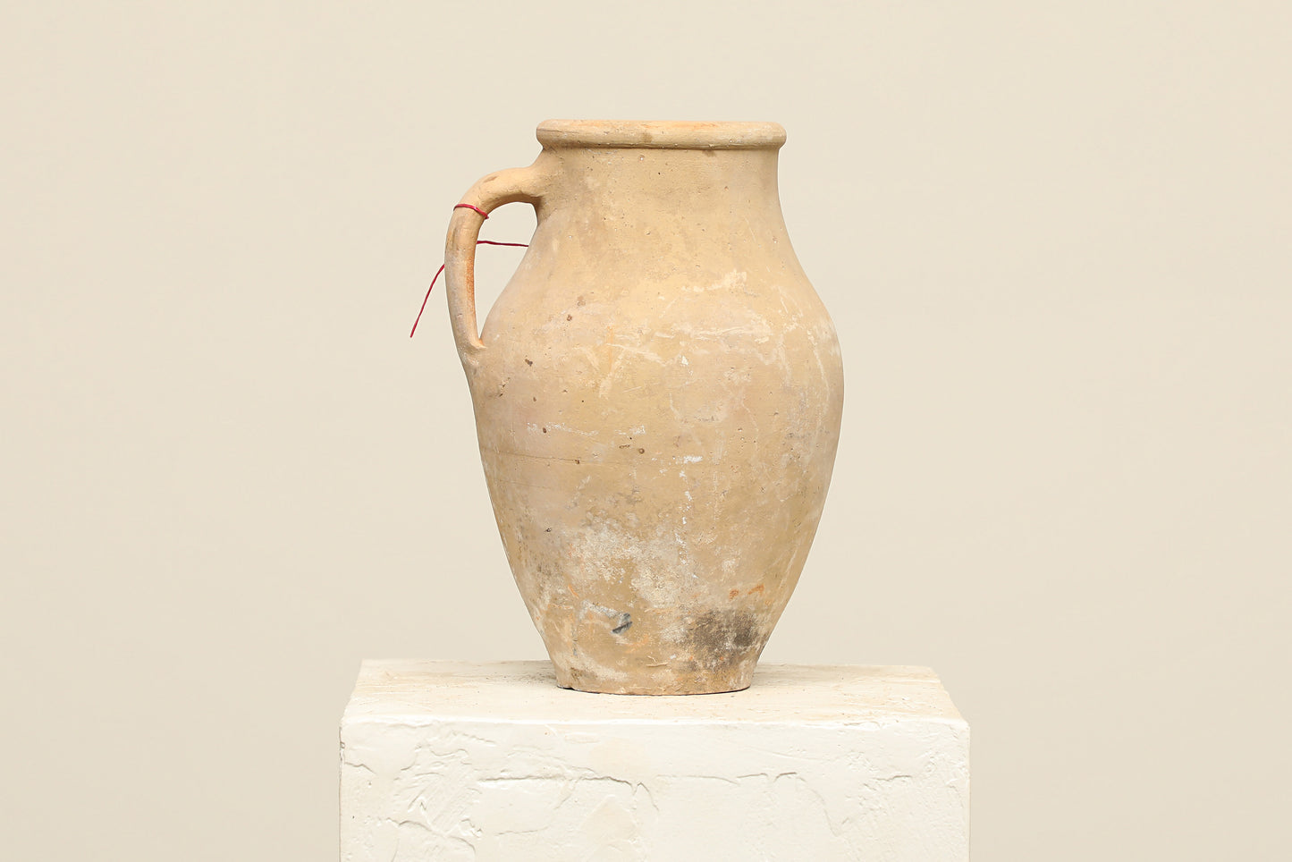 A one-of-a-kind clay brown Turkish vintage vase pot with a handle, crafted from terra cotta clay, this piece showcases timeless quality and antique craftsmanship, adding a unique touch of history to your space