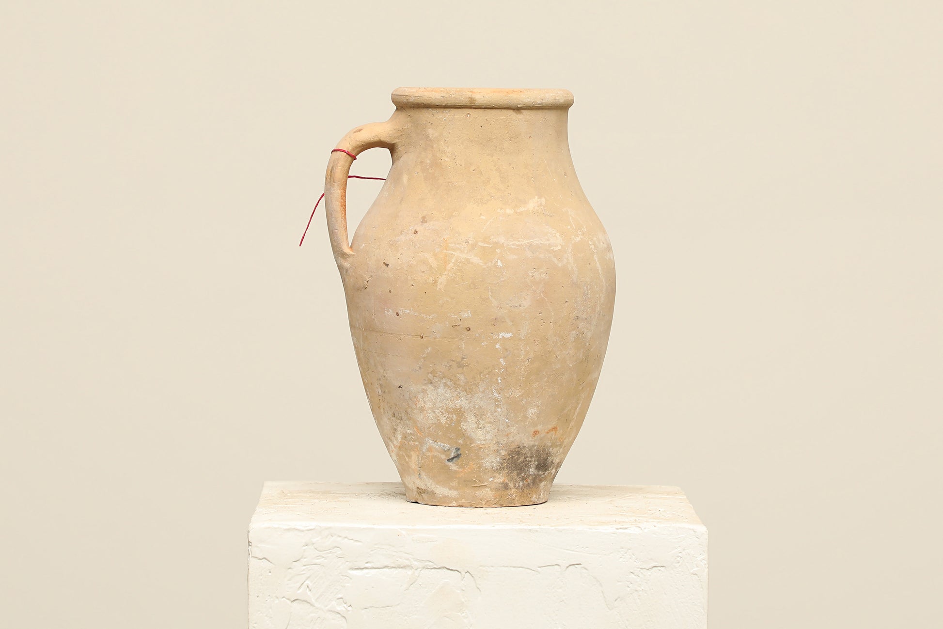A one-of-a-kind clay brown Turkish vintage vase pot with a handle, crafted from terra cotta clay, this piece showcases timeless quality and antique craftsmanship, adding a unique touch of history to your space