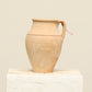 A one-of-a-kind clay brown Turkish vintage vase pot with a handle, crafted from terra cotta clay, this piece showcases timeless quality and antique craftsmanship, adding a unique touch of history to your space