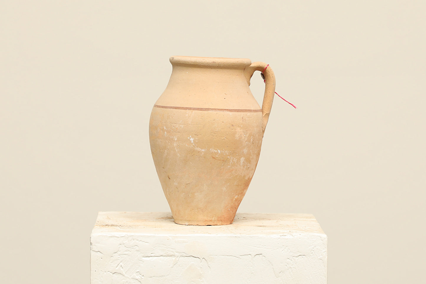 A one-of-a-kind clay brown Turkish vintage vase pot with a handle, crafted from terra cotta clay, this piece showcases timeless quality and antique craftsmanship, adding a unique touch of history to your space
