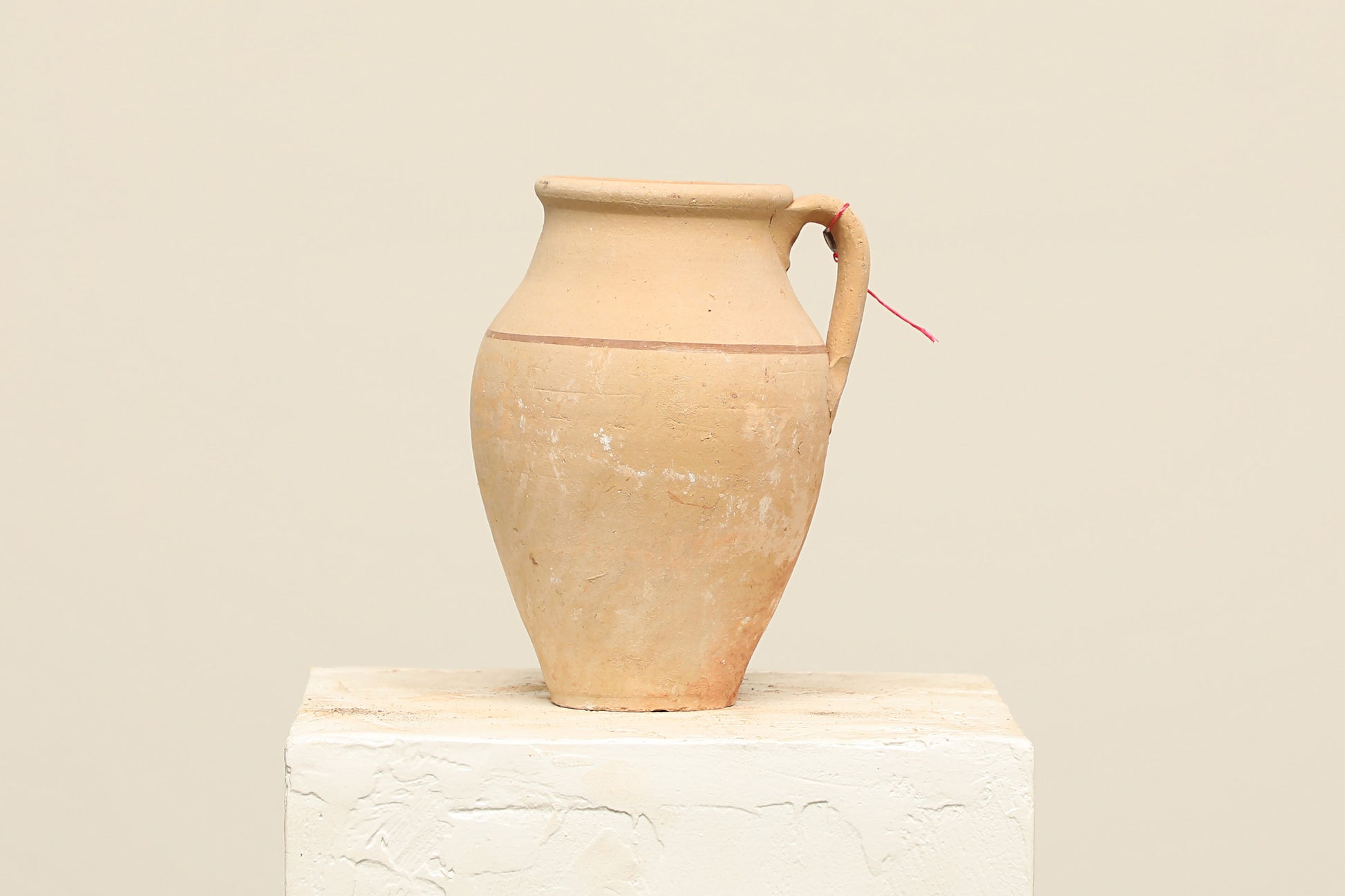 A one-of-a-kind clay brown Turkish vintage vase pot with a handle, crafted from terra cotta clay, this piece showcases timeless quality and antique craftsmanship, adding a unique touch of history to your space