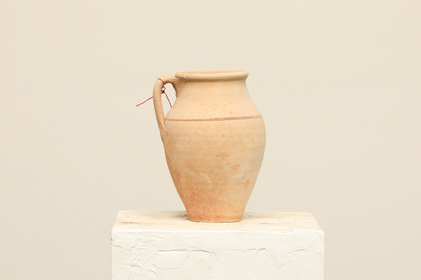A one-of-a-kind clay brown Turkish vintage vase pot with a handle, crafted from terra cotta clay, this piece showcases timeless quality and antique craftsmanship, adding a unique touch of history to your space