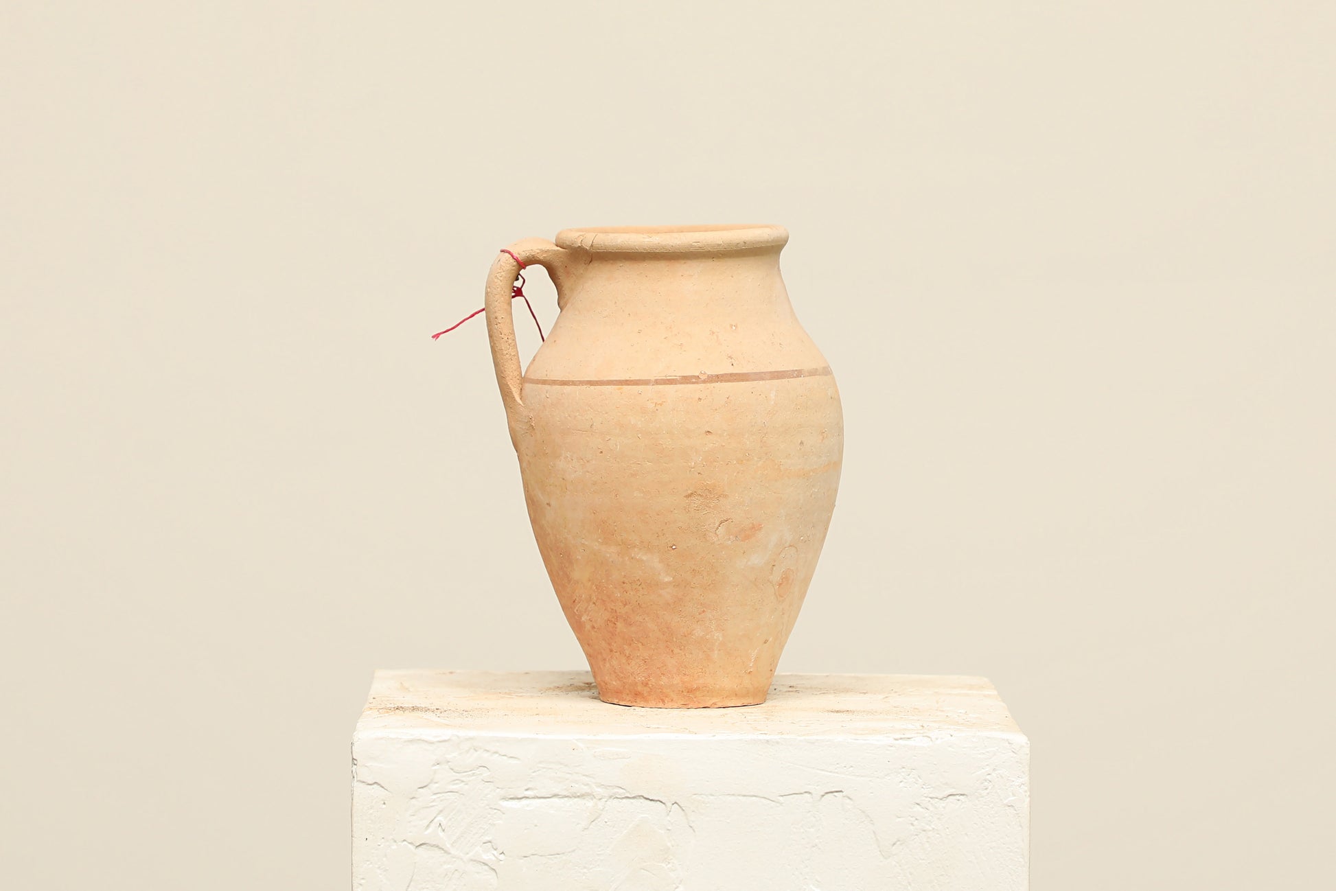 A one-of-a-kind clay brown Turkish vintage vase pot with a handle, crafted from terra cotta clay, this piece showcases timeless quality and antique craftsmanship, adding a unique touch of history to your space