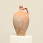 A one-of-a-kind clay brown Turkish vintage vase pot with a handle, crafted from terra cotta clay, this piece showcases timeless quality and antique craftsmanship, adding a unique touch of history to your space