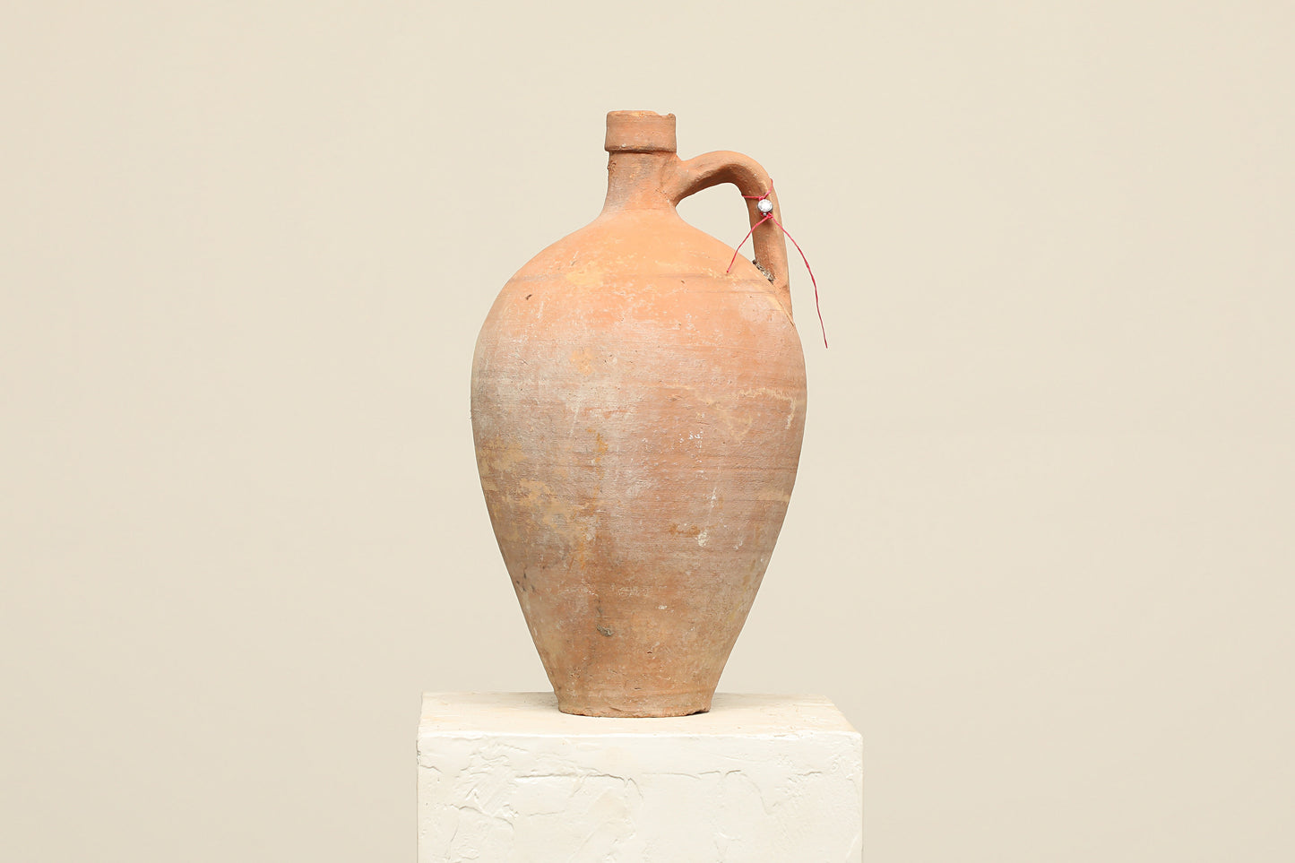 A one-of-a-kind clay brown Turkish vintage vase pot with a handle, crafted from terra cotta clay, this piece showcases timeless quality and antique craftsmanship, adding a unique touch of history to your space