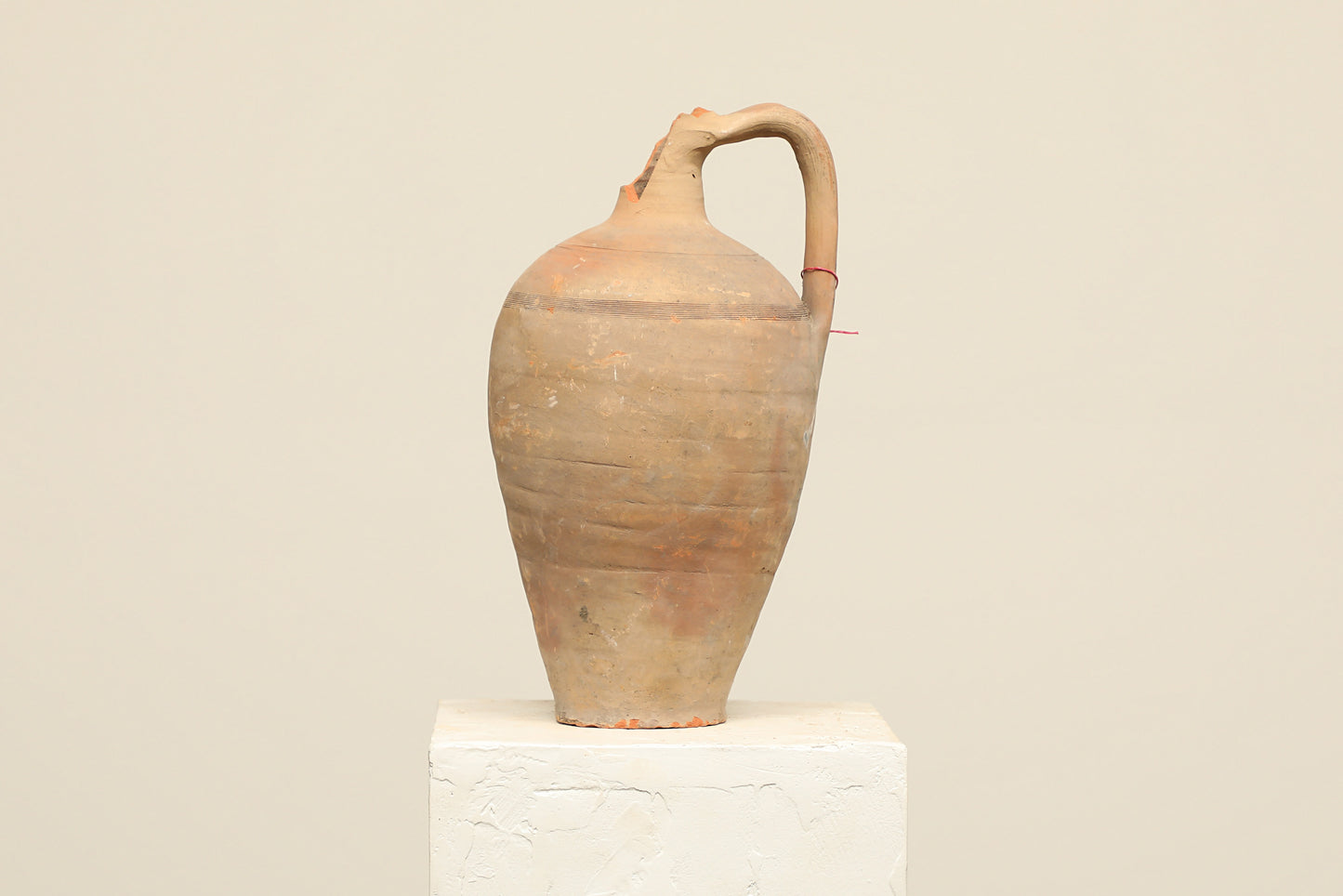 A one-of-a-kind clay brown Turkish vintage vase pot with a handle , crafted from terra cotta clay, this piece showcases timeless quality and antique craftsmanship, adding a unique touch of history to your space