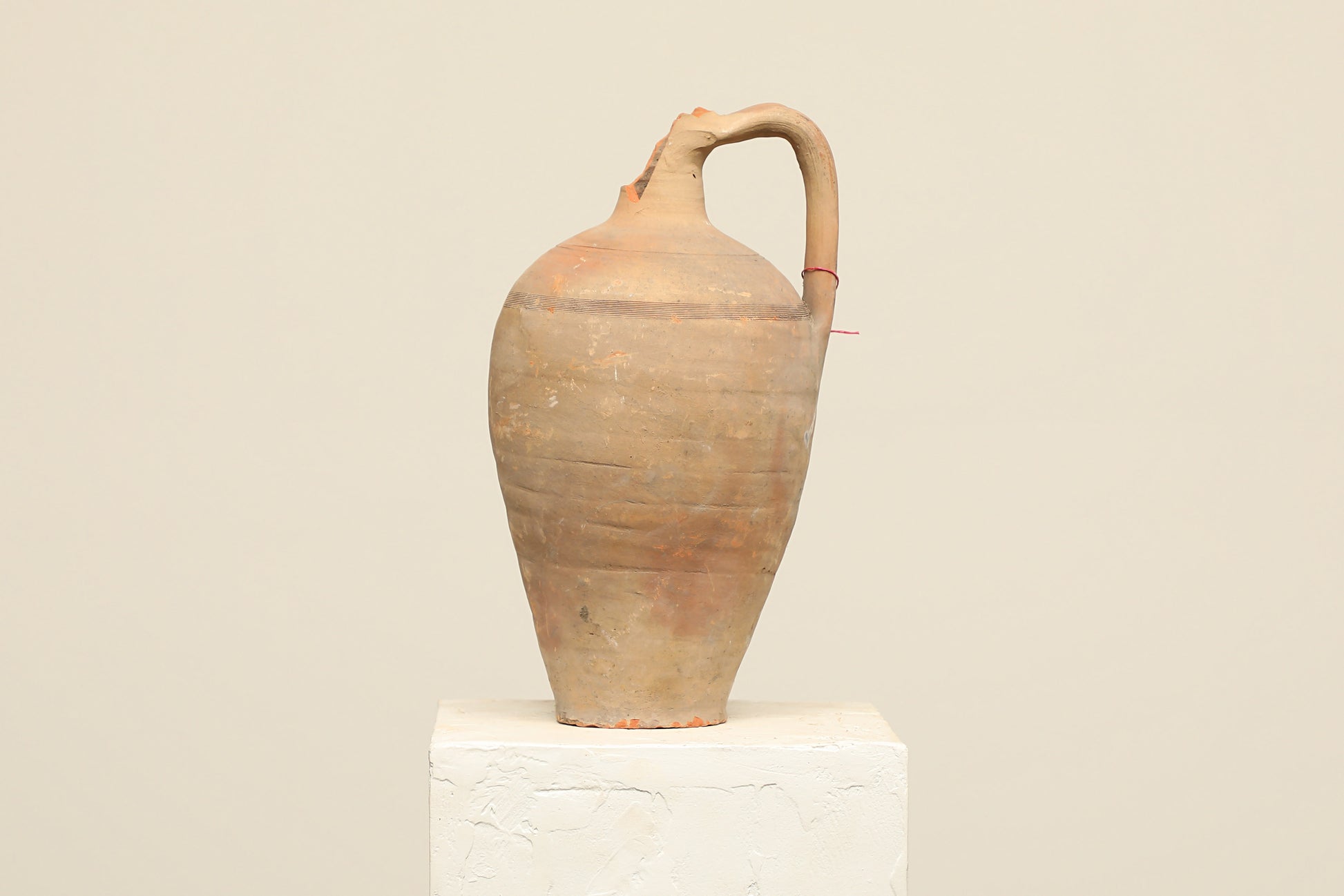 A one-of-a-kind clay brown Turkish vintage vase pot with a handle , crafted from terra cotta clay, this piece showcases timeless quality and antique craftsmanship, adding a unique touch of history to your space