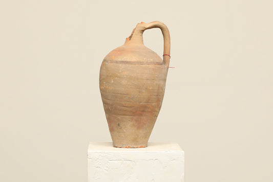 A one-of-a-kind clay brown Turkish vintage vase pot with a handle , crafted from terra cotta clay, this piece showcases timeless quality and antique craftsmanship, adding a unique touch of history to your space