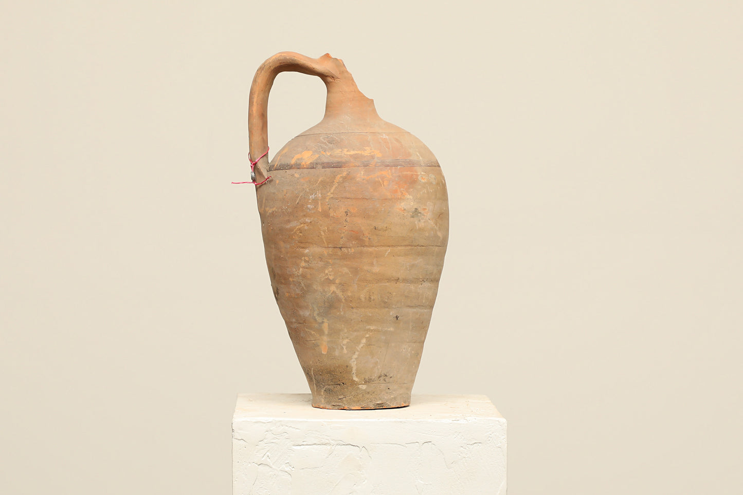 A one-of-a-kind clay brown Turkish vintage vase pot with a handle , crafted from terra cotta clay, this piece showcases timeless quality and antique craftsmanship, adding a unique touch of history to your space