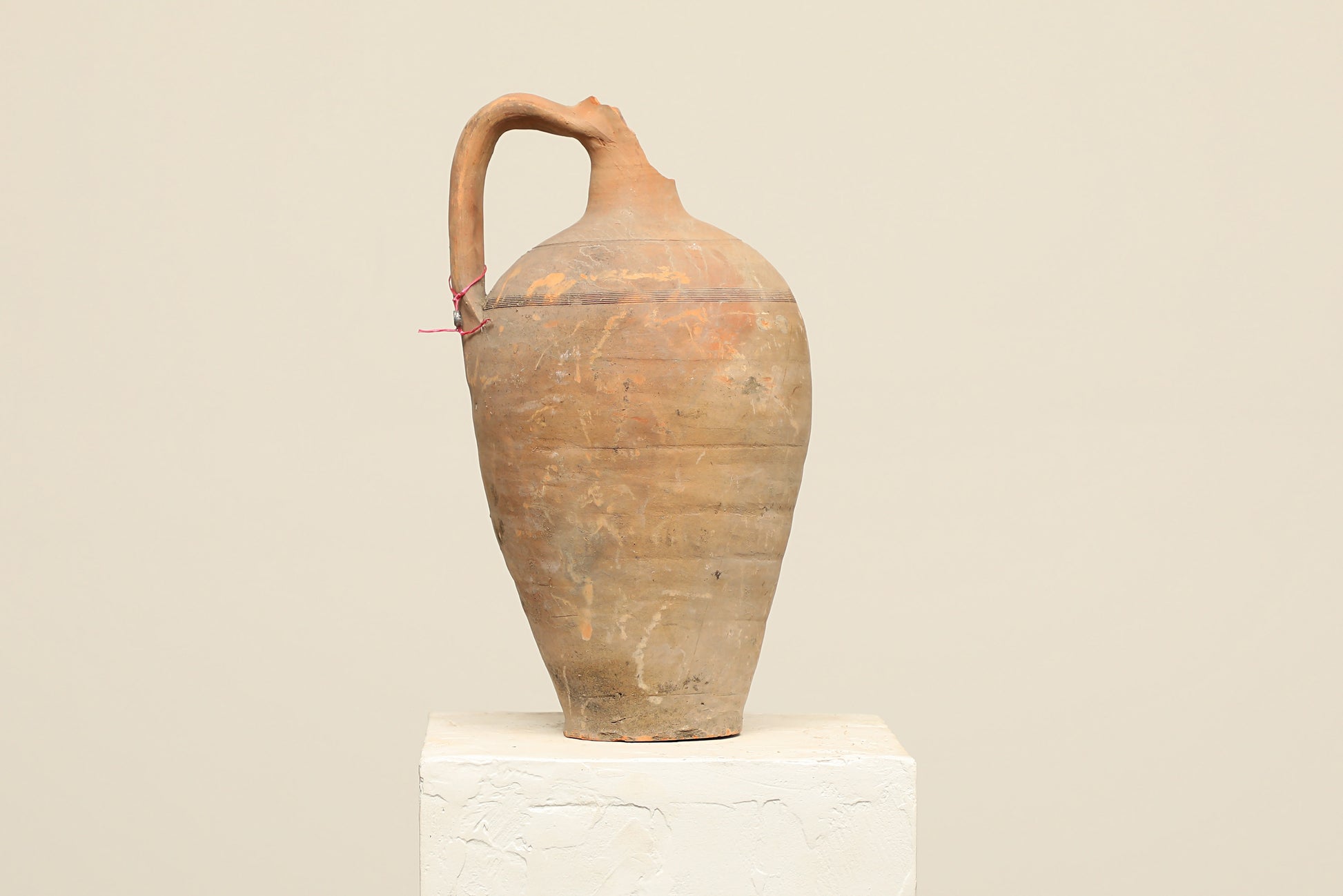 A one-of-a-kind clay brown Turkish vintage vase pot with a handle , crafted from terra cotta clay, this piece showcases timeless quality and antique craftsmanship, adding a unique touch of history to your space
