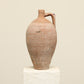 A one-of-a-kind clay brown Turkish vintage vase pot with a handle, crafted from terra cotta clay, this piece showcases timeless quality and antique craftsmanship, adding a unique touch of history to your space