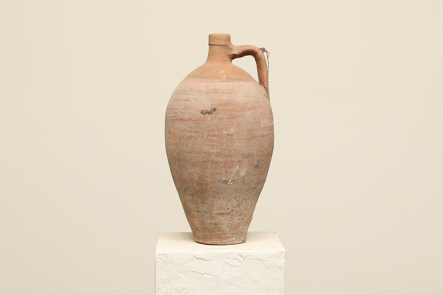 A one-of-a-kind clay brown Turkish vintage vase pot with a handle, crafted from terra cotta clay, this piece showcases timeless quality and antique craftsmanship, adding a unique touch of history to your space