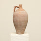 A one-of-a-kind clay brown Turkish vintage vase pot with a handle, crafted from terra cotta clay, this piece showcases timeless quality and antique craftsmanship, adding a unique touch of history to your space