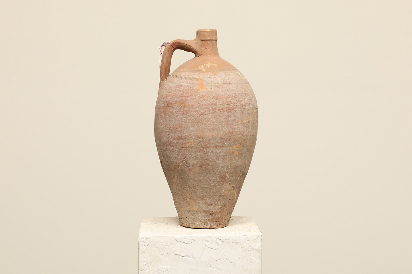 A one-of-a-kind clay brown Turkish vintage vase pot with a handle, crafted from terra cotta clay, this piece showcases timeless quality and antique craftsmanship, adding a unique touch of history to your space