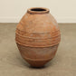 A one-of-a-kind clay brown Turkish vintage vase pot without a handle, crafted from terra cotta clay, this piece showcases timeless quality and antique craftsmanship, adding a unique touch of history to your space