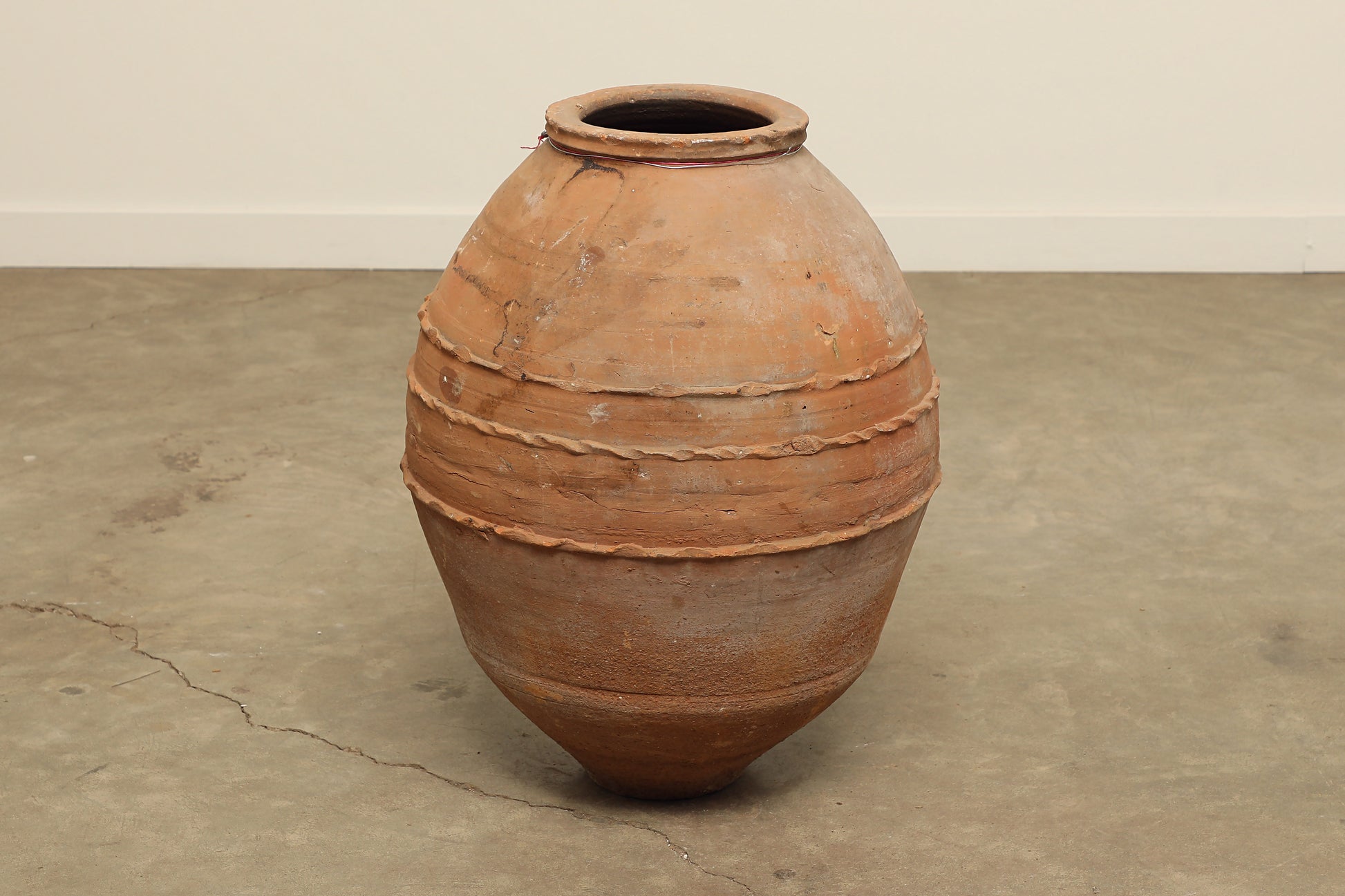 A one-of-a-kind clay brown Turkish vintage vase pot without a handle, crafted from terra cotta clay, this piece showcases timeless quality and antique craftsmanship, adding a unique touch of history to your space