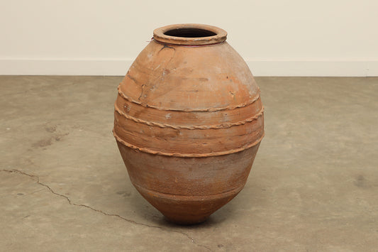 A one-of-a-kind clay brown Turkish vintage vase pot without a handle, crafted from terra cotta clay, this piece showcases timeless quality and antique craftsmanship, adding a unique touch of history to your space