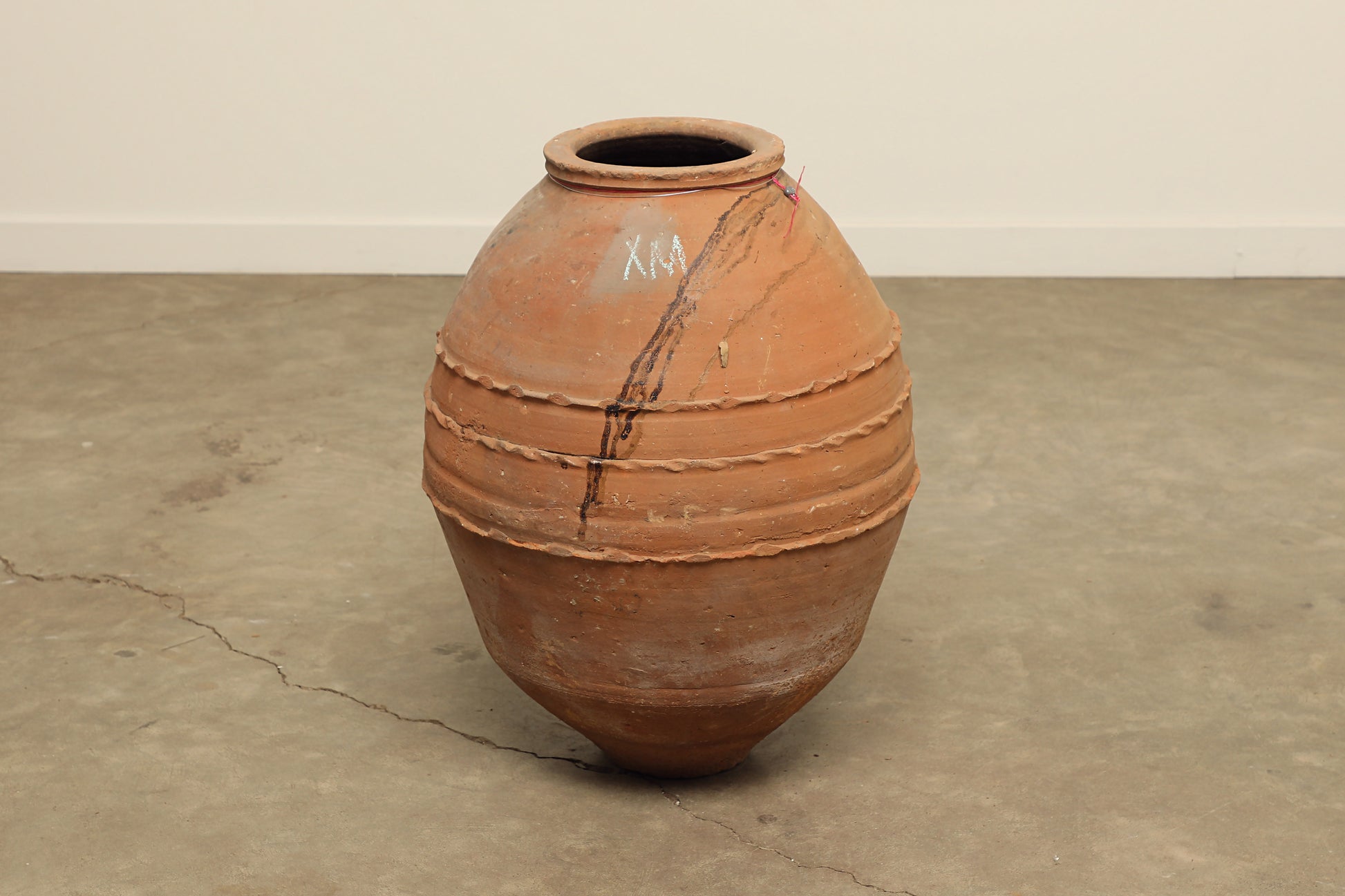 A one-of-a-kind clay brown Turkish vintage vase pot without a handle, crafted from terra cotta clay, this piece showcases timeless quality and antique craftsmanship, adding a unique touch of history to your space