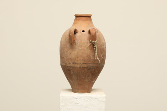 A one-of-a-kind clay brown Turkish vintage vase pot with two handles, crafted from terra cotta clay, this piece showcases timeless quality and antique craftsmanship, adding a unique touch of history to your space