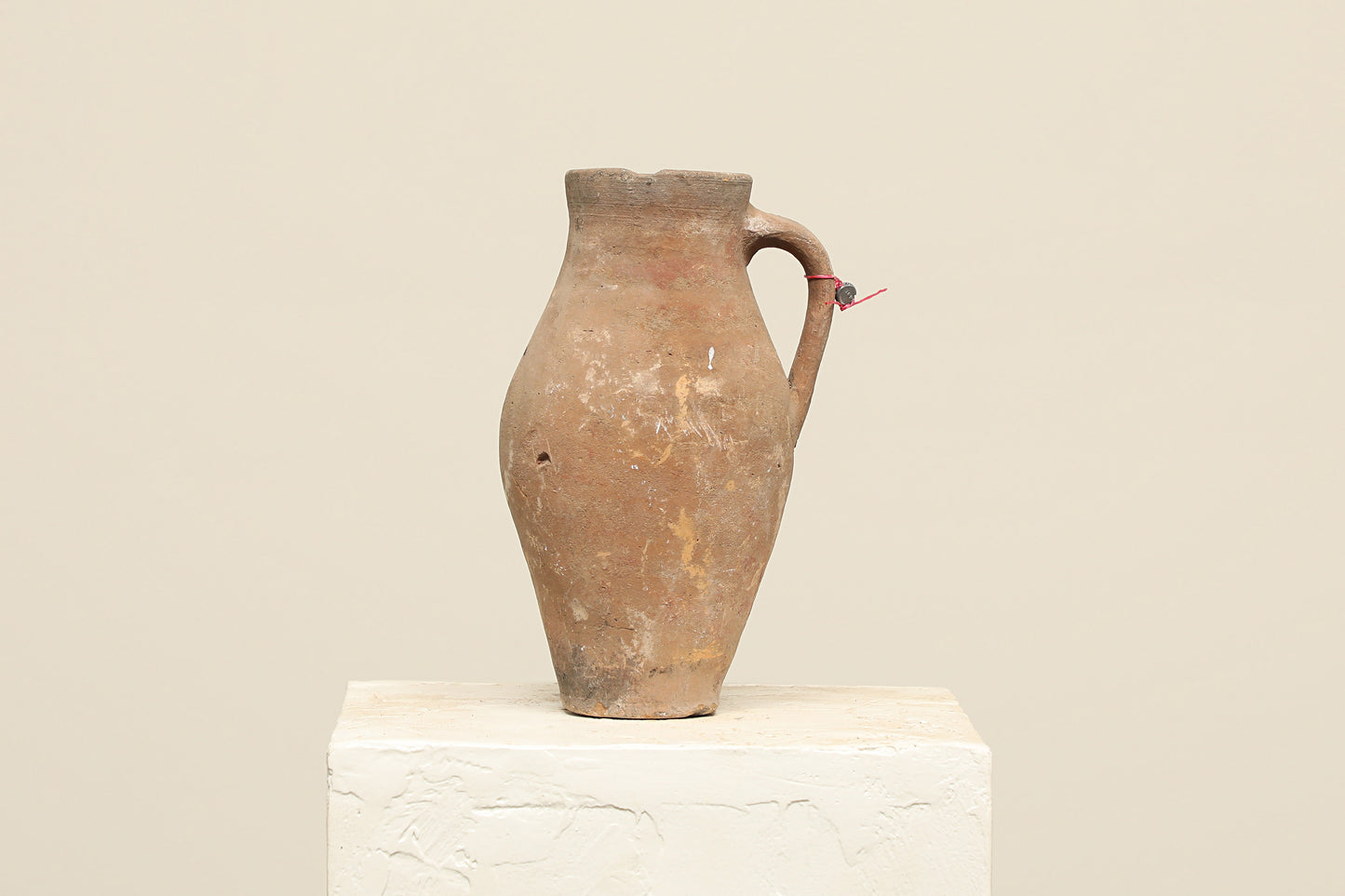 A one-of-a-kind clay brown Turkish vintage vase pot with a handle, crafted from terra cotta clay, this piece showcases timeless quality and antique craftsmanship, adding a unique touch of history to your space