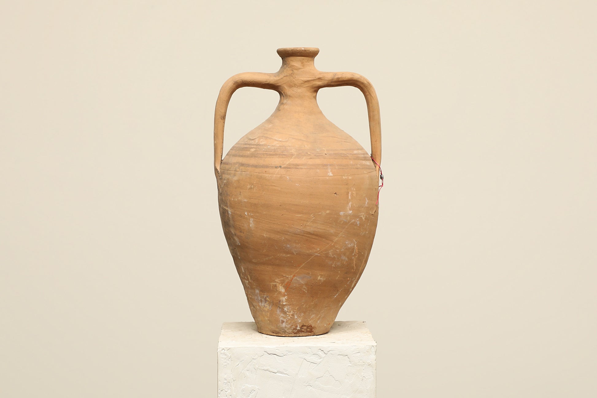 A one-of-a-kind clay brown Turkish vintage vase pot with two handles, crafted from terra cotta clay, this piece showcases timeless quality and antique craftsmanship, adding a unique touch of history to your space