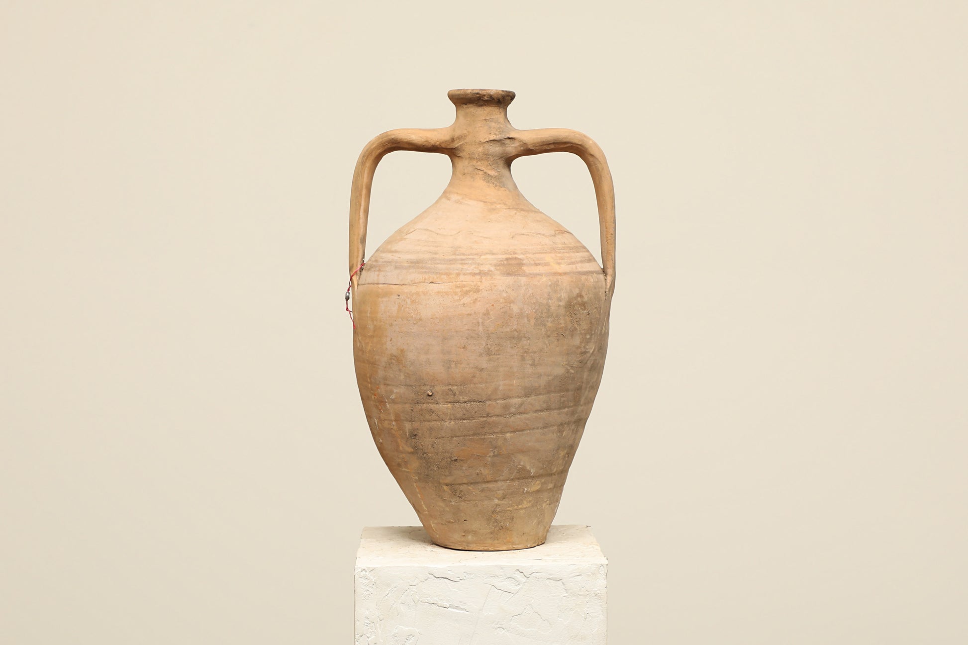 A one-of-a-kind clay brown Turkish vintage vase pot with two handles, crafted from terra cotta clay, this piece showcases timeless quality and antique craftsmanship, adding a unique touch of history to your space