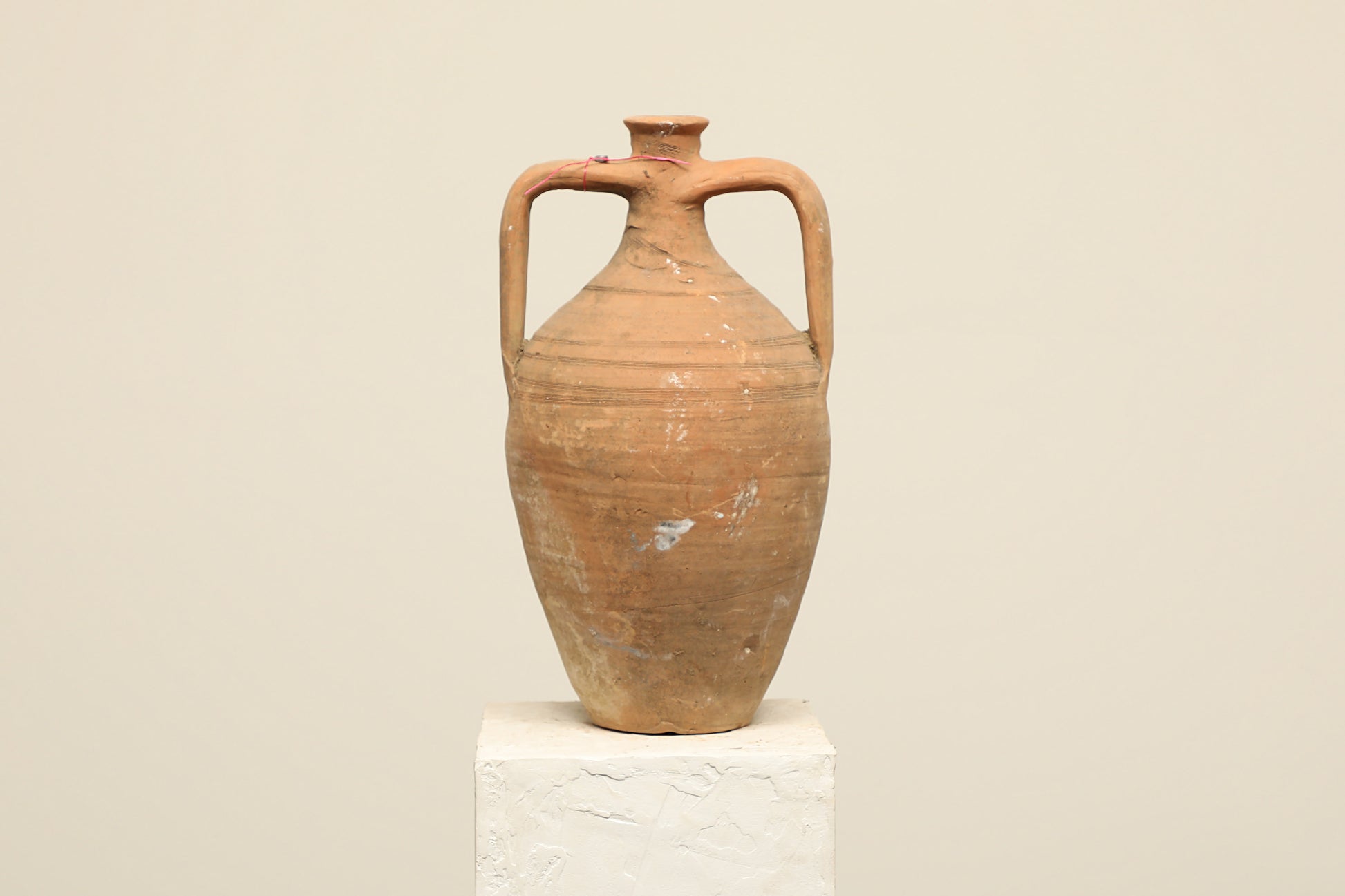 A one-of-a-kind clay brown Turkish vintage vase pot with two handles, crafted from terra cotta clay, this piece showcases timeless quality and antique craftsmanship, adding a unique touch of history to your space