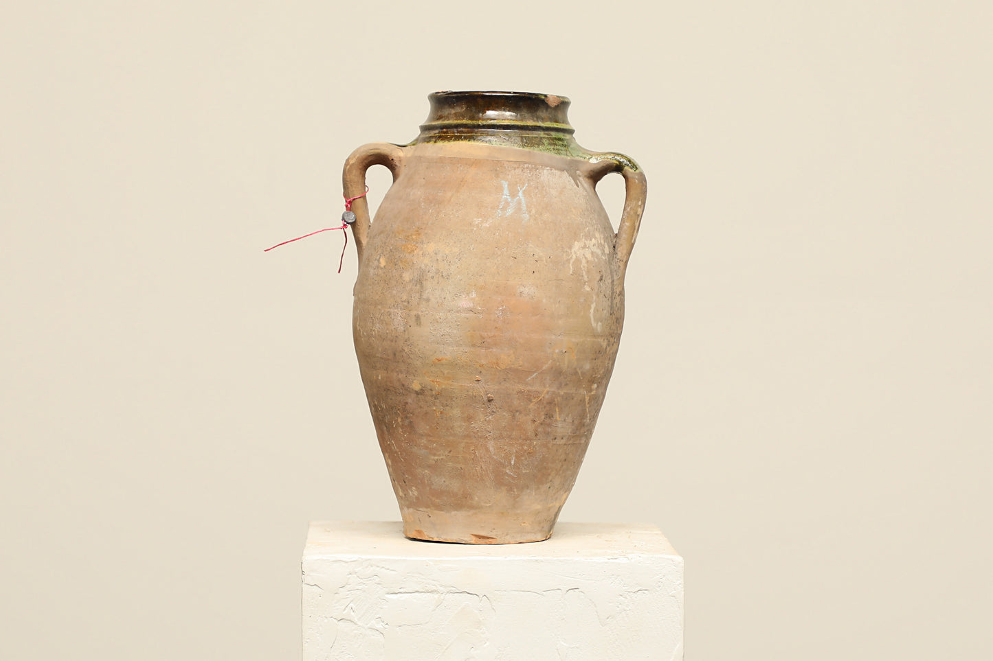 A one-of-a-kind clay brown Turkish vintage vase pot with two handles, crafted from terra cotta clay, this piece showcases timeless quality and antique craftsmanship, adding a unique touch of history to your space
