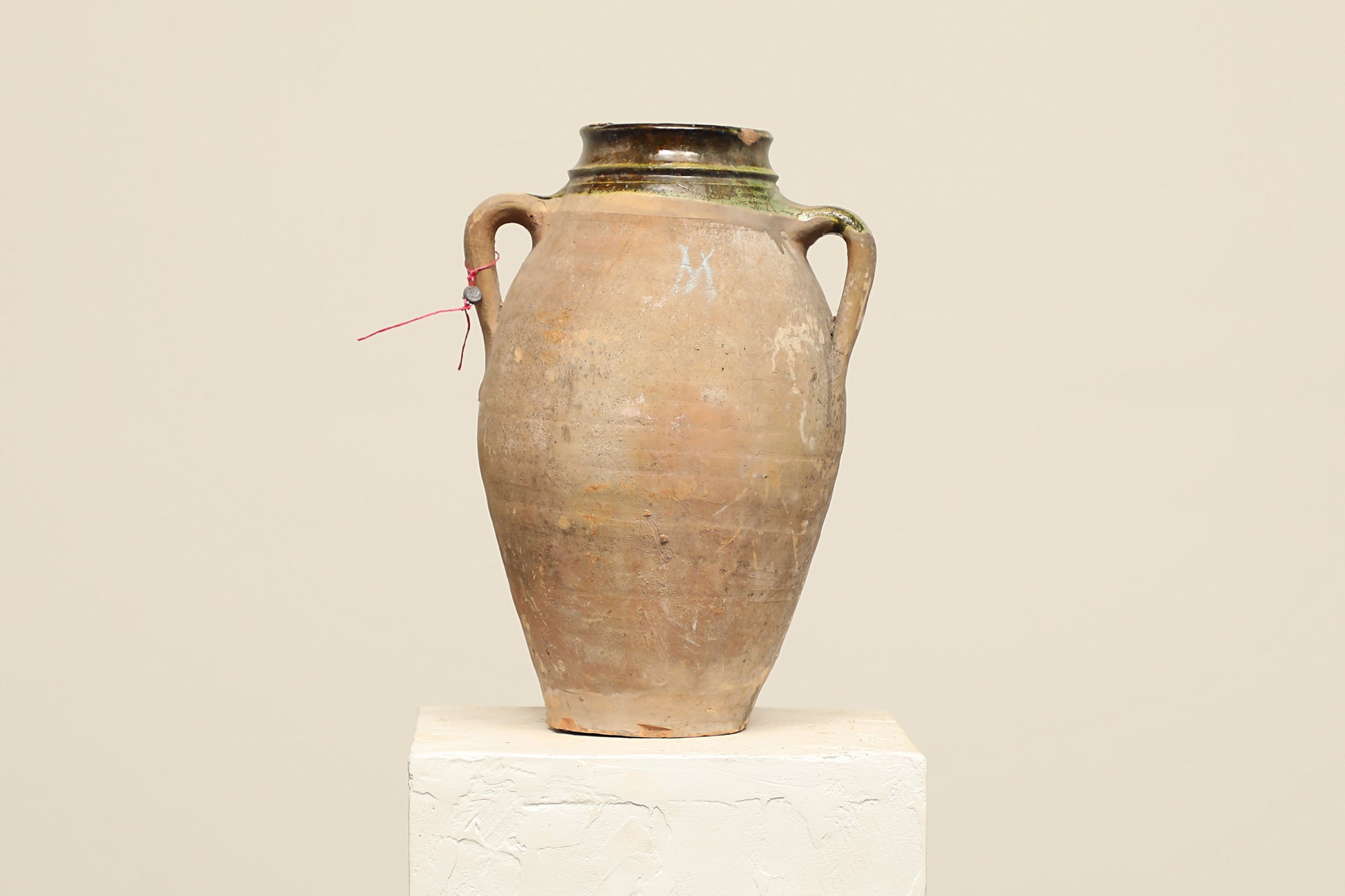A one-of-a-kind clay brown Turkish vintage vase pot with two handles, crafted from terra cotta clay, this piece showcases timeless quality and antique craftsmanship, adding a unique touch of history to your space