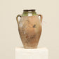 A one-of-a-kind clay brown Turkish vintage vase pot with two handles, crafted from terra cotta clay, this piece showcases timeless quality and antique craftsmanship, adding a unique touch of history to your space