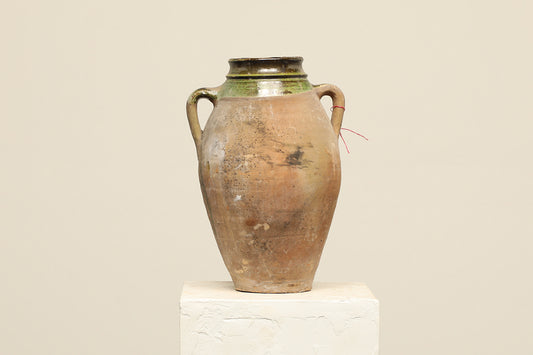A one-of-a-kind clay brown Turkish vintage vase pot with two handles, crafted from terra cotta clay, this piece showcases timeless quality and antique craftsmanship, adding a unique touch of history to your space