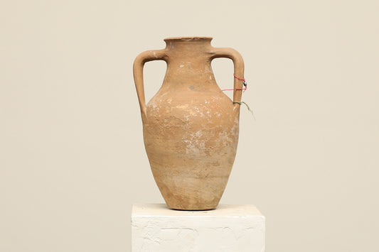 A one-of-a-kind clay brown Turkish vintage vase pot with two handles, crafted from terra cotta clay, this piece showcases timeless quality and antique craftsmanship, adding a unique touch of history to your space