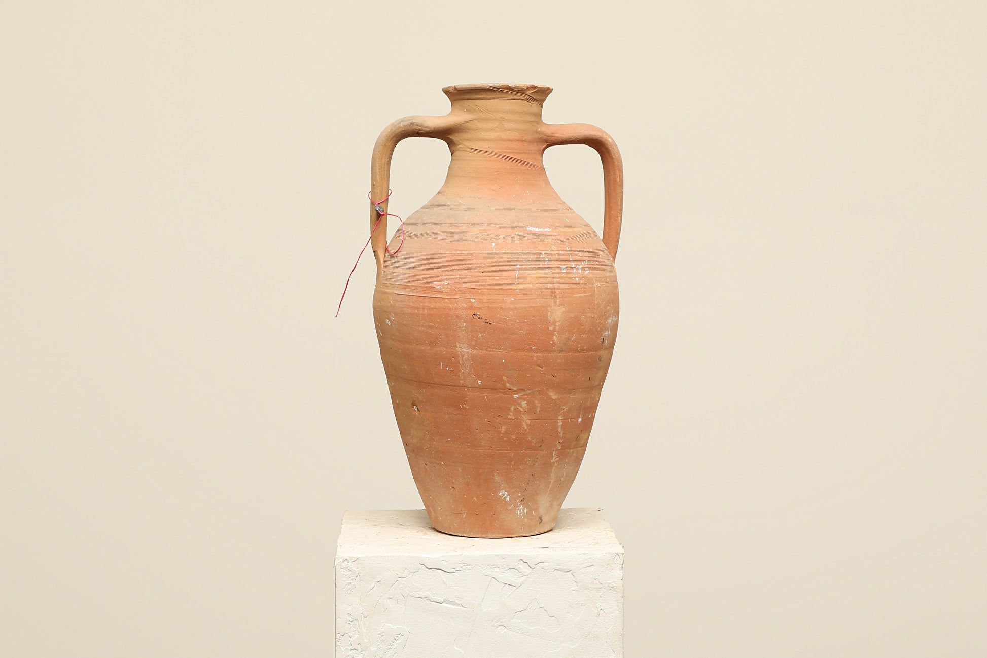 A one-of-a-kind clay brown Turkish vintage vase pot with two handles, crafted from terra cotta clay, this piece showcases timeless quality and antique craftsmanship, adding a unique touch of history to your space