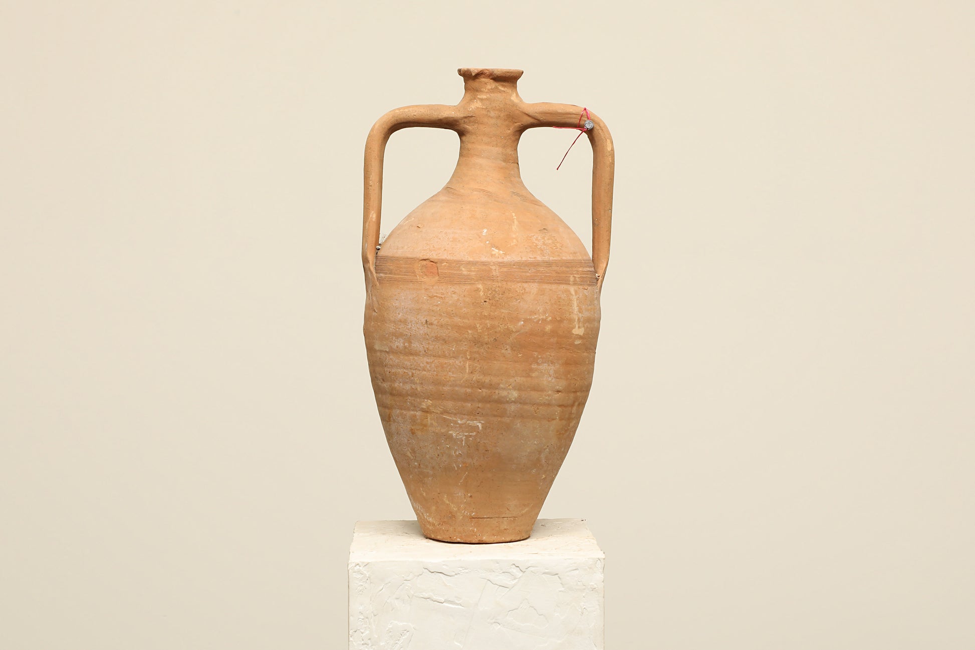 A one-of-a-kind clay brown Turkish vintage vase pot with two handles, crafted from terra cotta clay, this piece showcases timeless quality and antique craftsmanship, adding a unique touch of history to your space