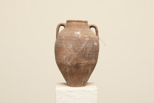 A one-of-a-kind clay brown Turkish vintage vase pot with two handles, crafted from terra cotta clay, this piece showcases timeless quality and antique craftsmanship, adding a unique touch of history to your space
