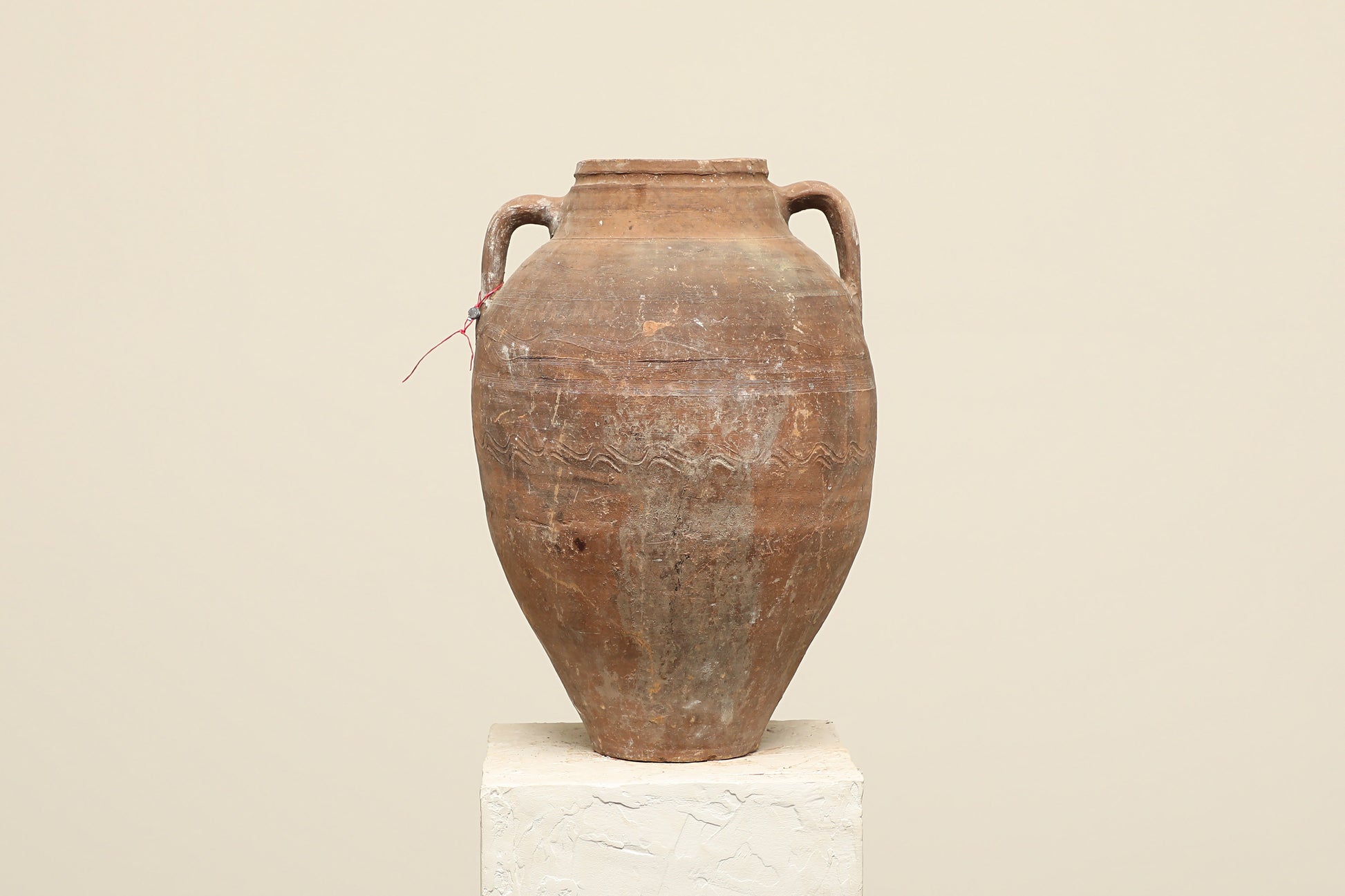 A one-of-a-kind clay brown Turkish vintage vase pot with two handles, crafted from terra cotta clay, this piece showcases timeless quality and antique craftsmanship, adding a unique touch of history to your space
