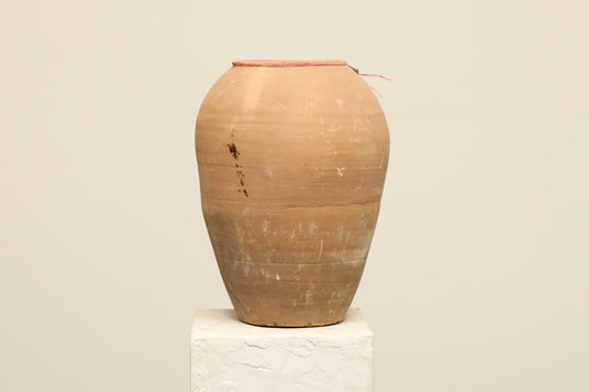 A one-of-a-kind clay brown Turkish vintage vase pot without a handle, crafted from terra cotta clay, this piece showcases timeless quality and antique craftsmanship, adding a unique touch of history to your space