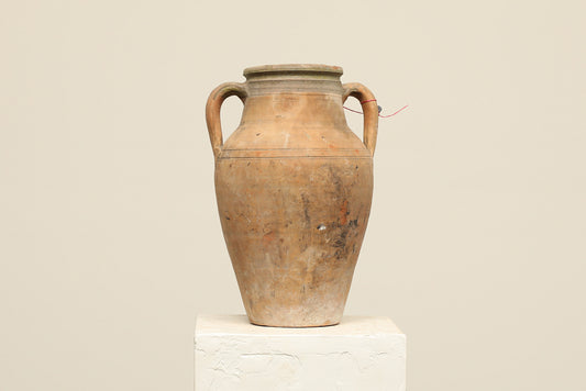 A one-of-a-kind clay brown Turkish vintage vase pot with two handles, crafted from terra cotta clay, this piece showcases timeless quality and antique craftsmanship, adding a unique touch of history to your space